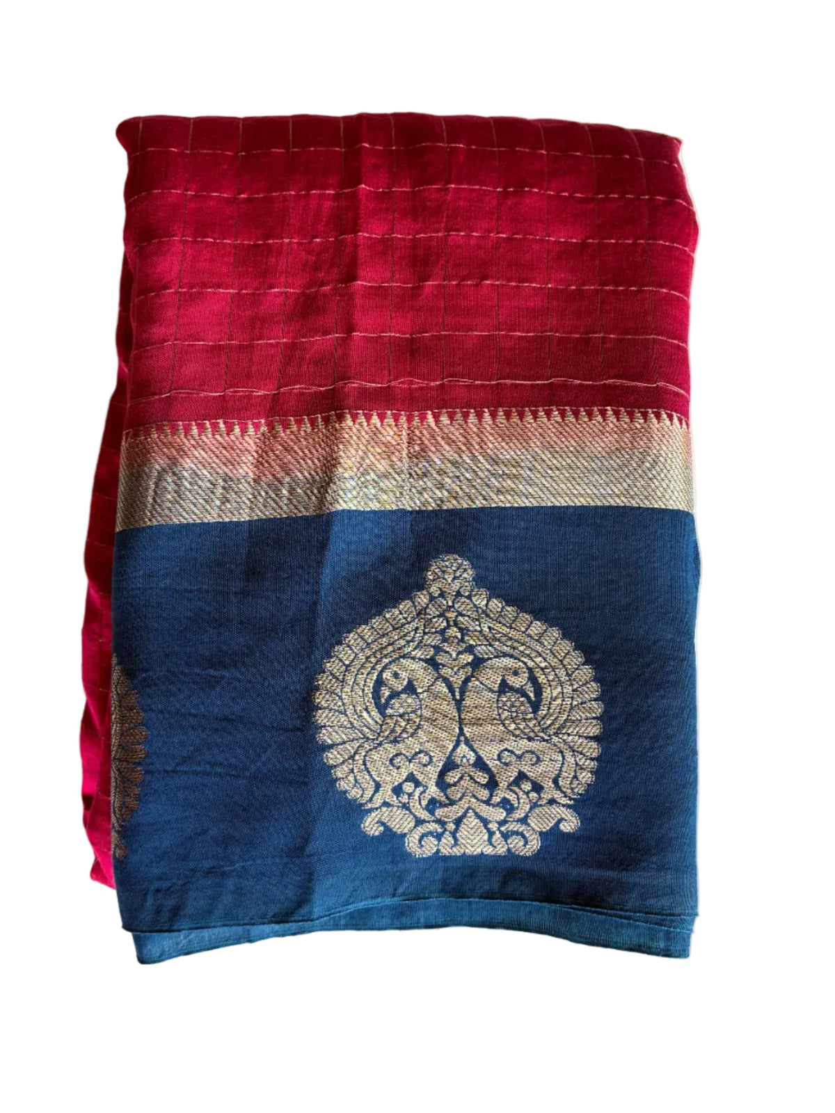 Neatly folded light comfortable magenta pink checks saree with gold zari border detail