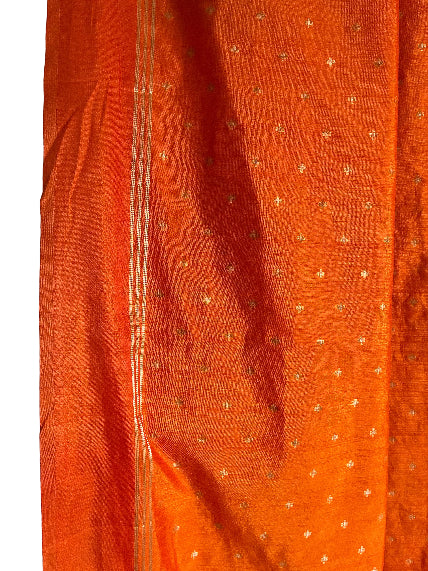 Close up of soft breathable orange jute silk texture and weave detailing