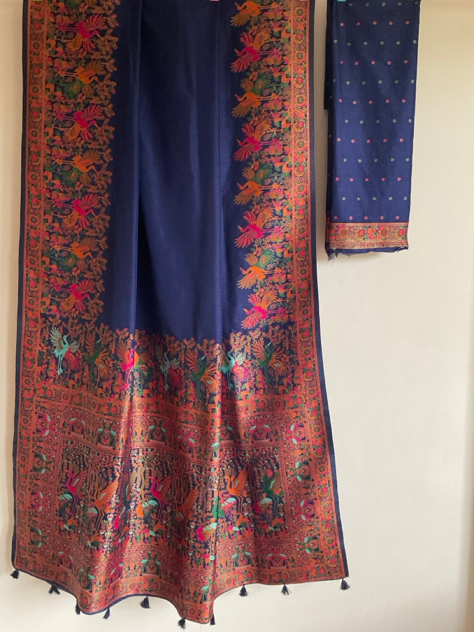 Navy blue handwoven silk saree with rust peacock meenakari border and silk tassels