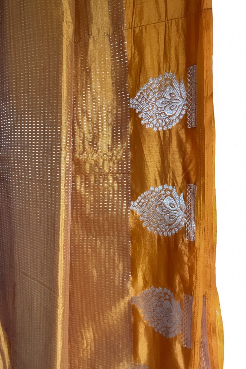 Yellow Tissue Silk Saree with Silver Zari Butis & Gold Tassel Border