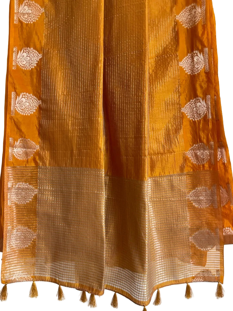 Yellow sarees with gold patterns and tassels on a white background