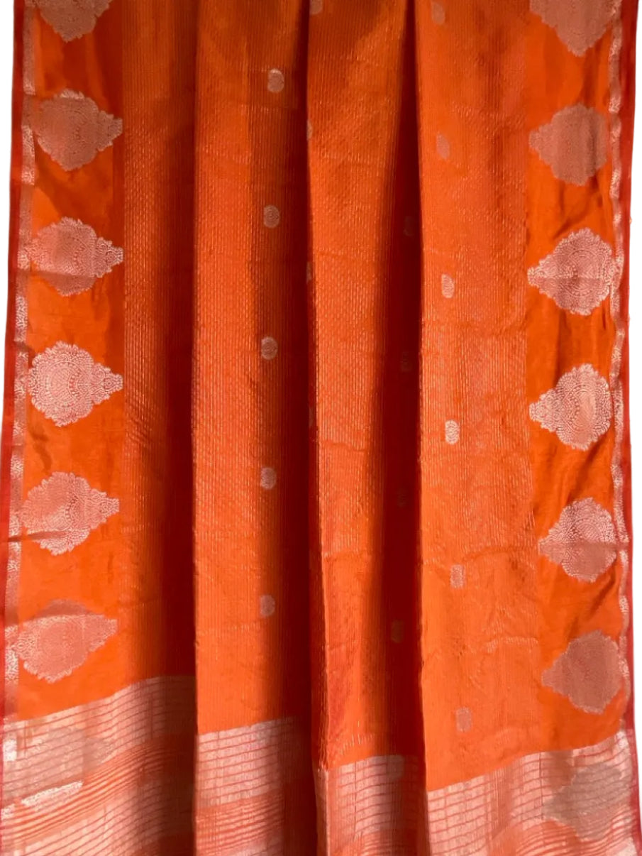 Orange saree with gold motifs on a white background