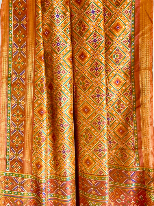 Yellow Double Ikat Patola Silk Saree with Multicolour Geometric Diamond Jaal & Rust Zari Border