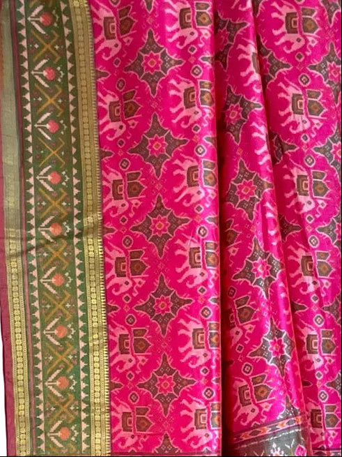 Pink saree  with intricate patterns and a green border