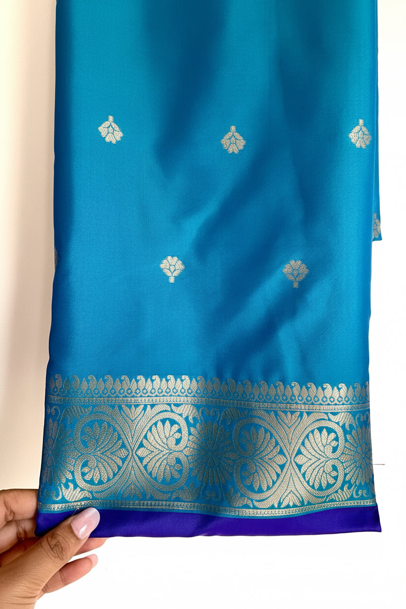 Royal Purple & Teal Silk Saree with Silver Peacock Buttas & patola Border