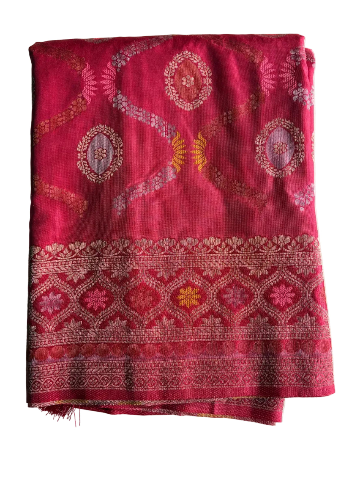 Neatly folded light comfortable bright pink red soft silk saree showing metallic border and floral motifs