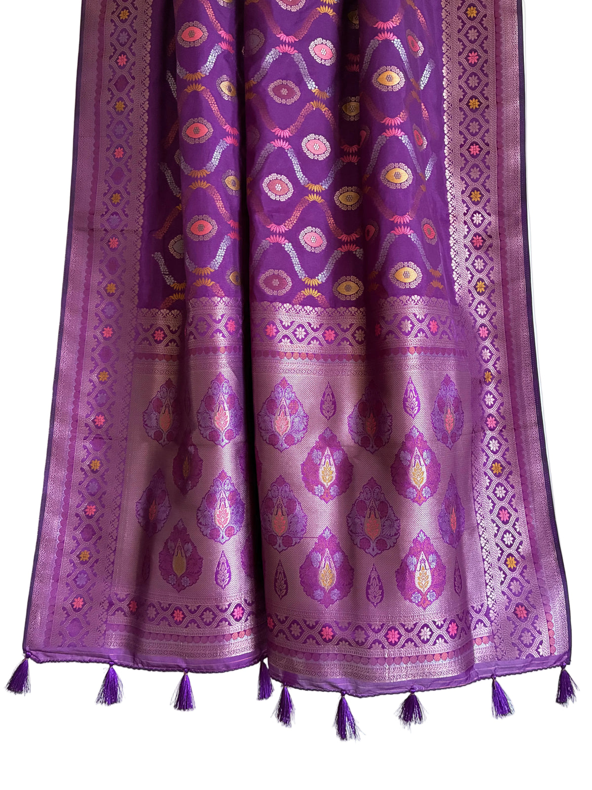 Detailed view of rich purple saree pallu with ornate Banarasi detailing and matching tassels
