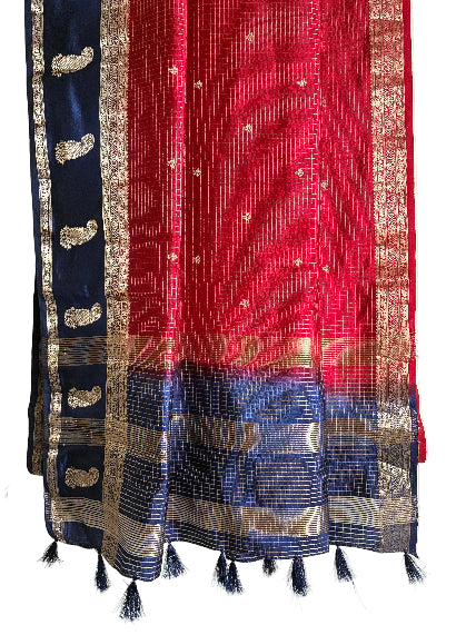 Detailed view of red checked saree pallu framed by blue border with gold mango design