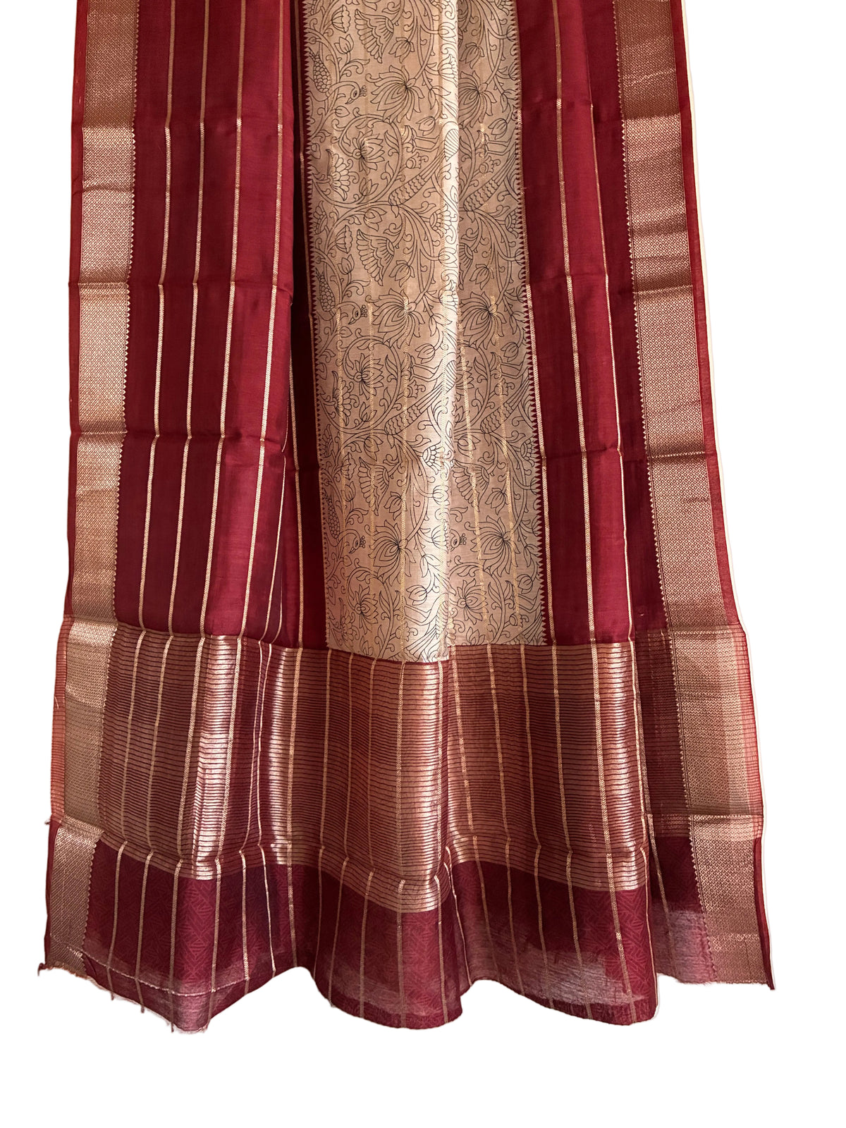 Detailed view of rich deep red saree pallu with ornate white Kalamkari floral motifs and lustrous border