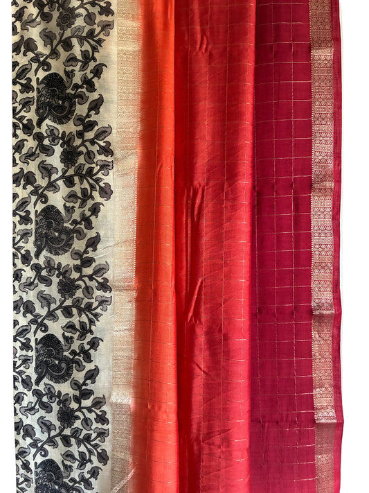 Close up of soft breathable Assam silk weave with red and orange with gold checks