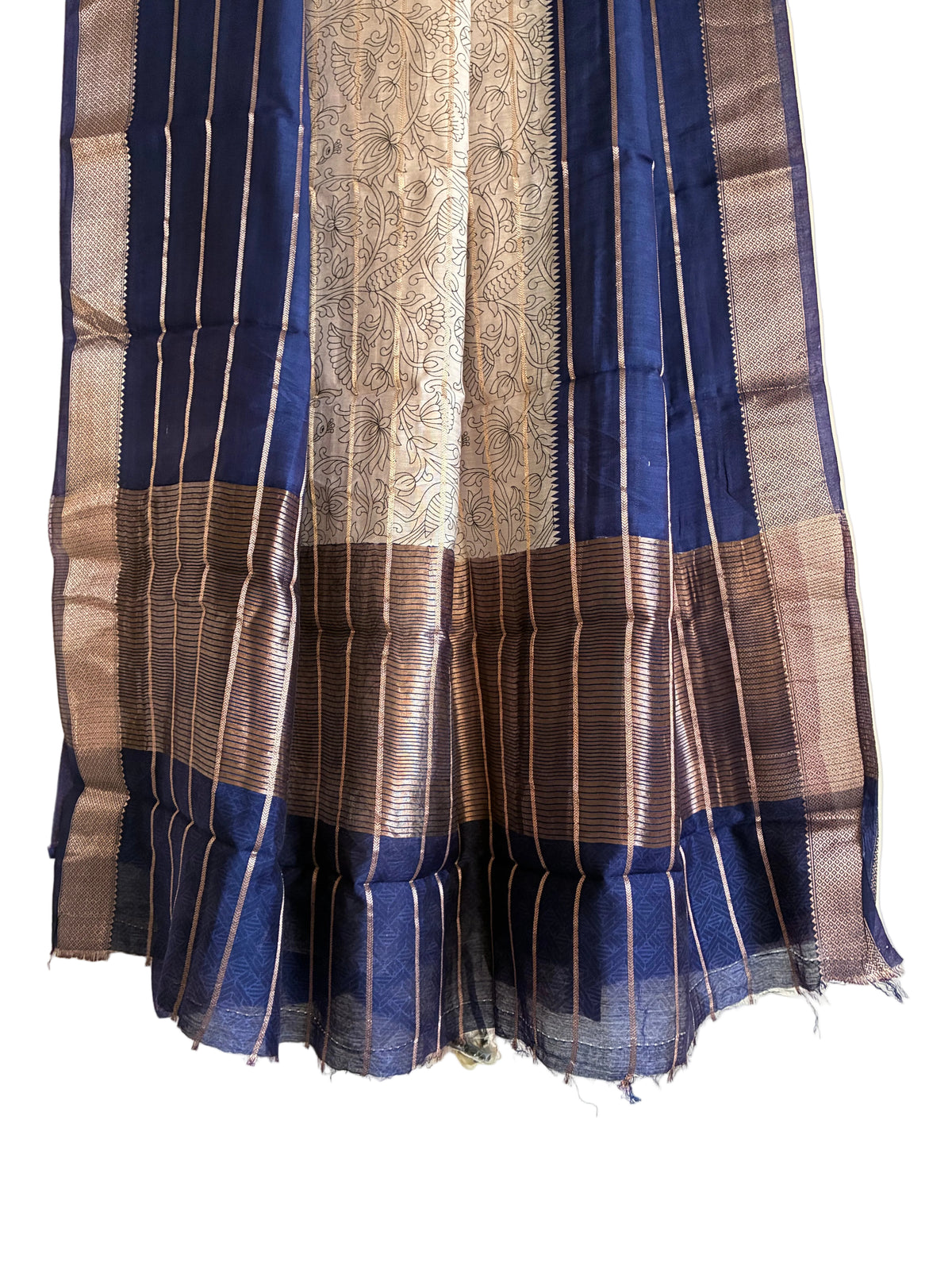 Detailed view of rich royal blue saree pallu with ornate white Kalamkari floral motifs and gold border