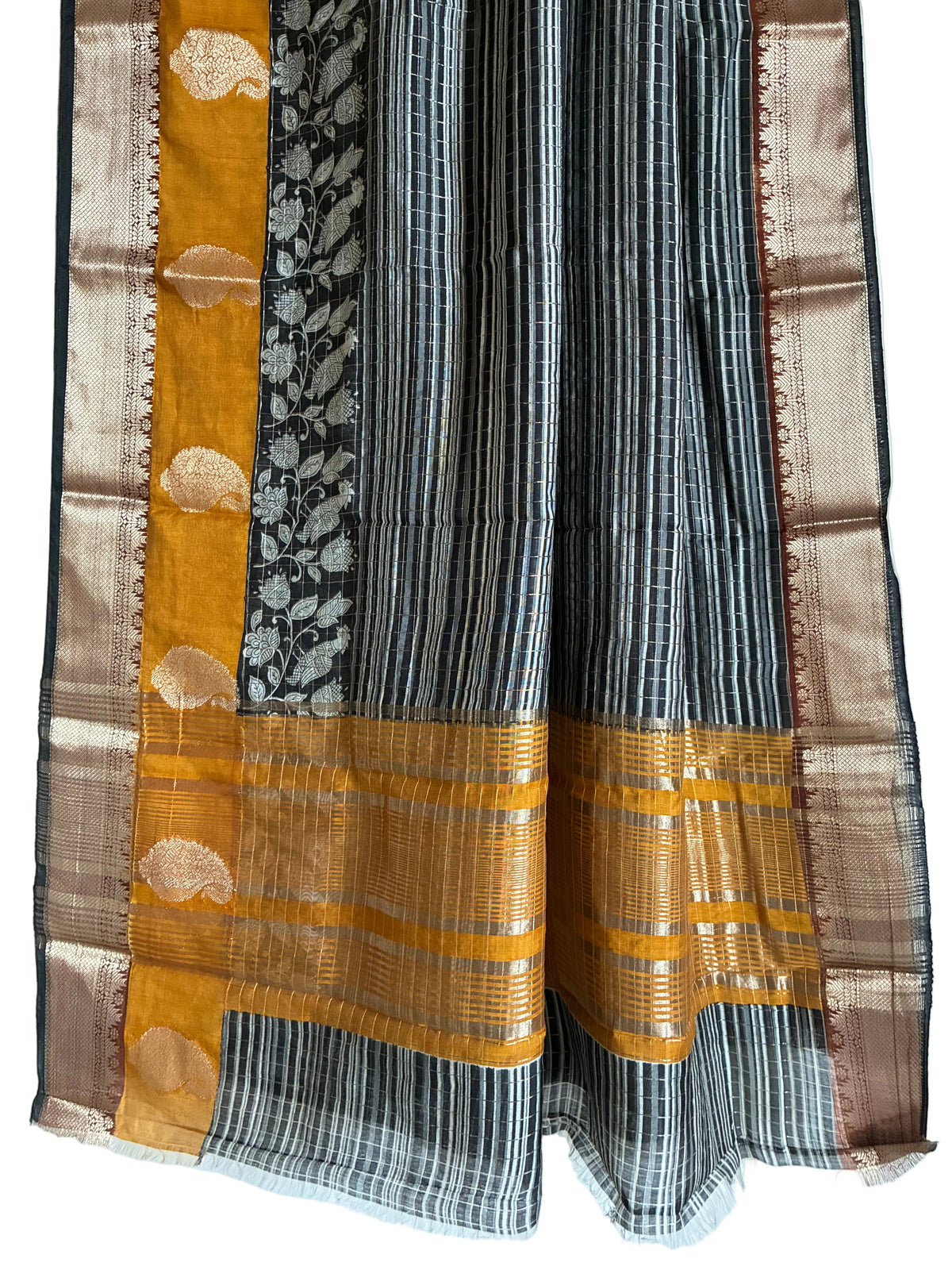 Detailed view of rich Assam silk saree pallu featuring Kalamkari floral vines and mustard accents