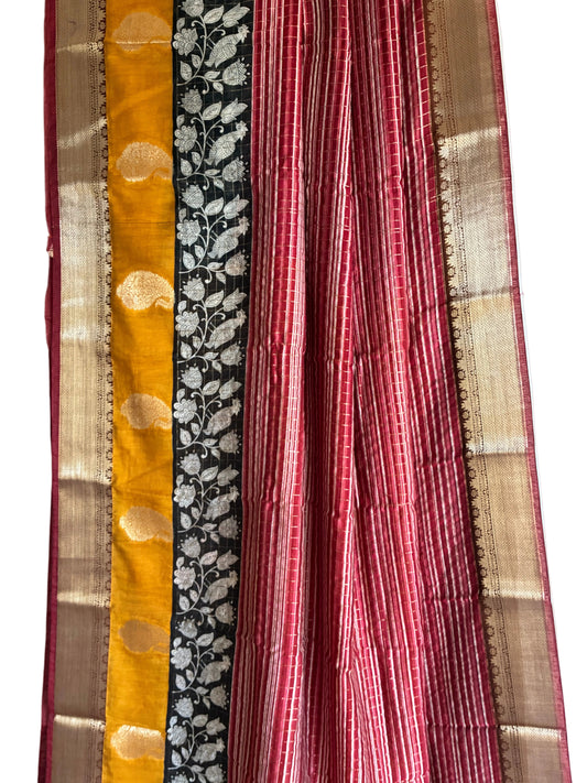 Close up of soft breathable red Assam silk weave featuring fine stripes and gold-toned motifs
