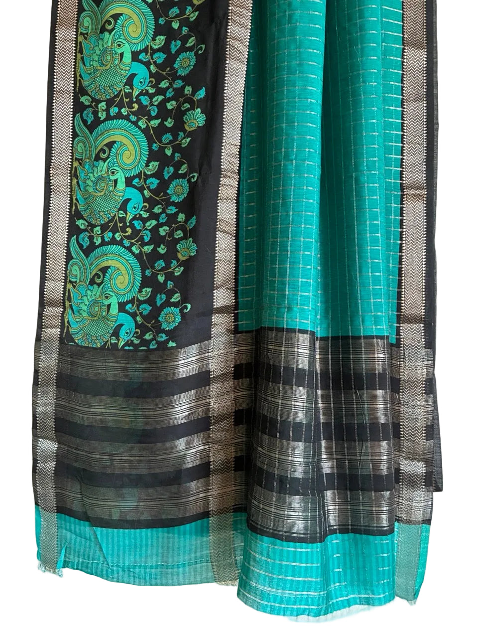 Detailed view of bold teal blue saree pallu with artistic Kalamkari designs and contrast black border