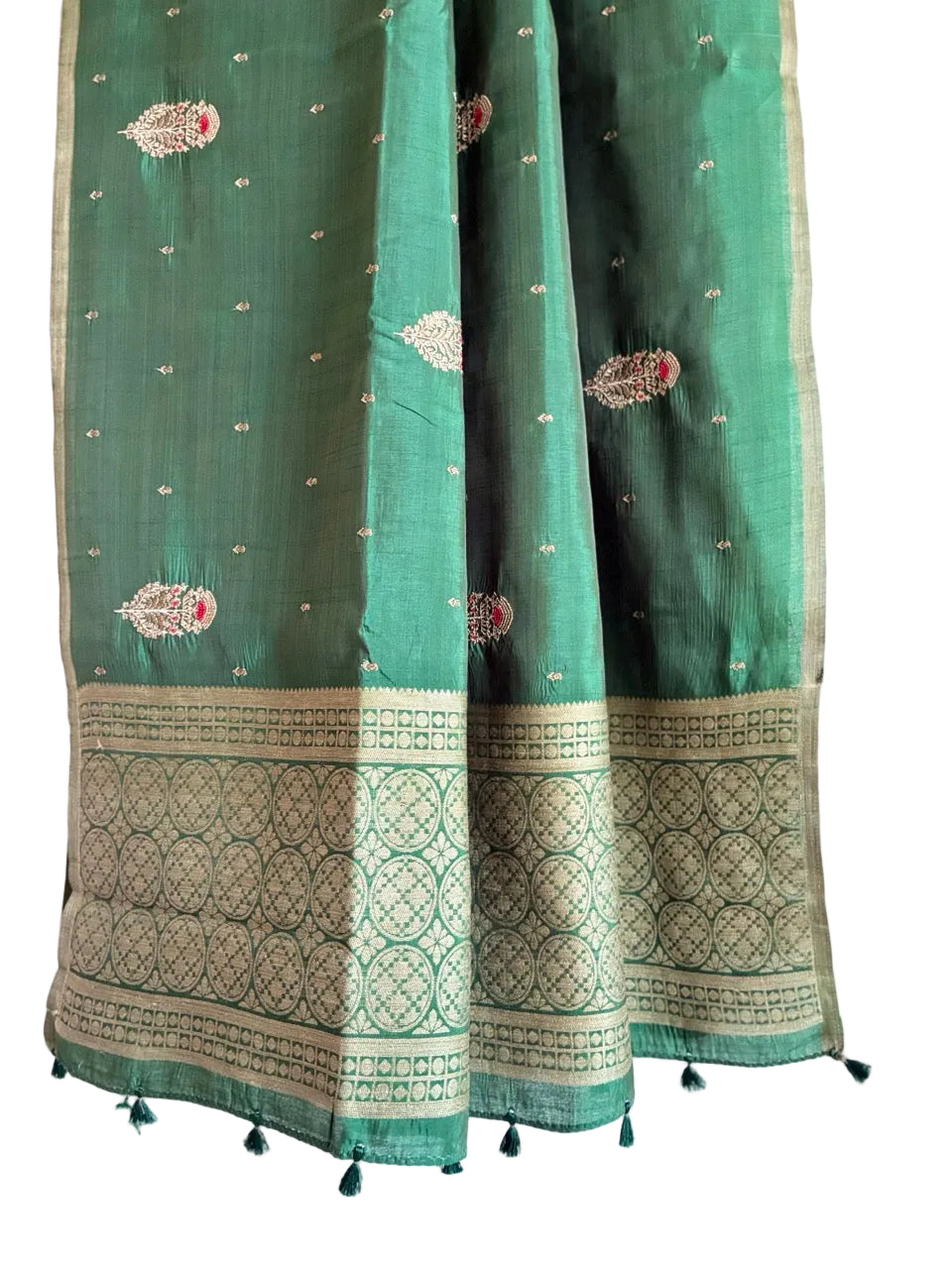 Detailed view of elegant green saree pallu styled for daily wear and office wear