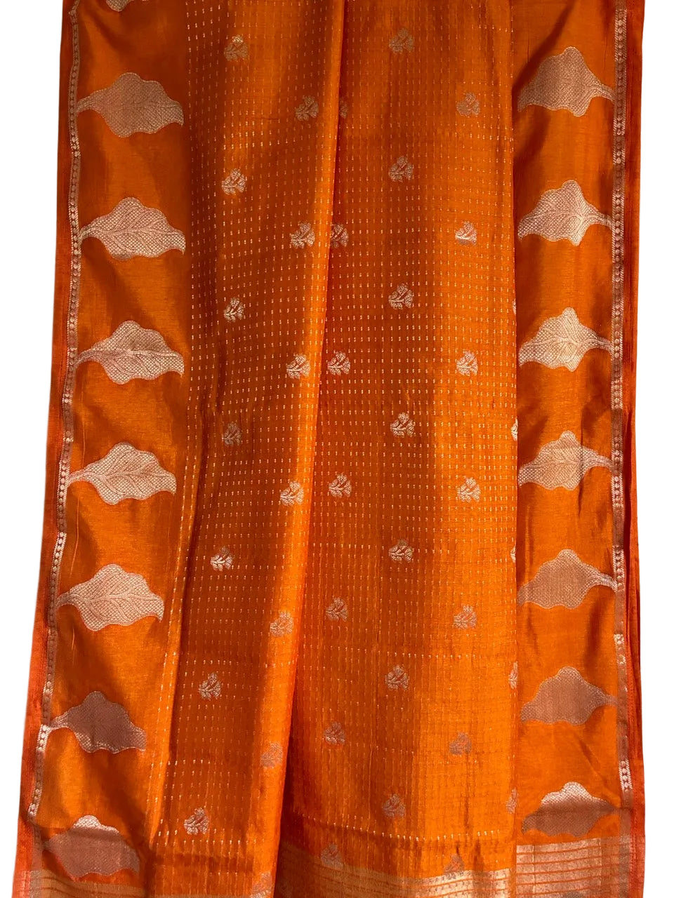 Vibrant orange saree with gold tone butis and leaf motif border full drape view Aariyaa studio Bangalore