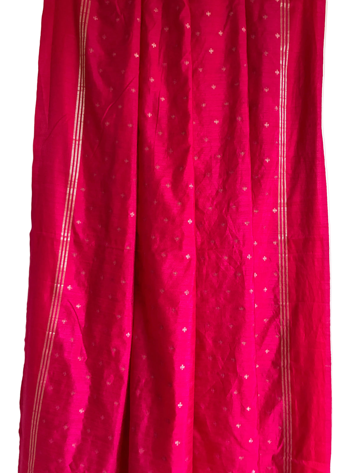 Close up of soft breathable bright pink jute silk saree fabric texture and weave detail