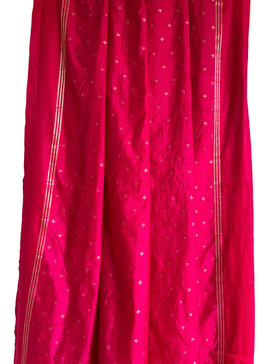 Close up of soft breathable bright pink jute silk saree fabric texture and weave detail