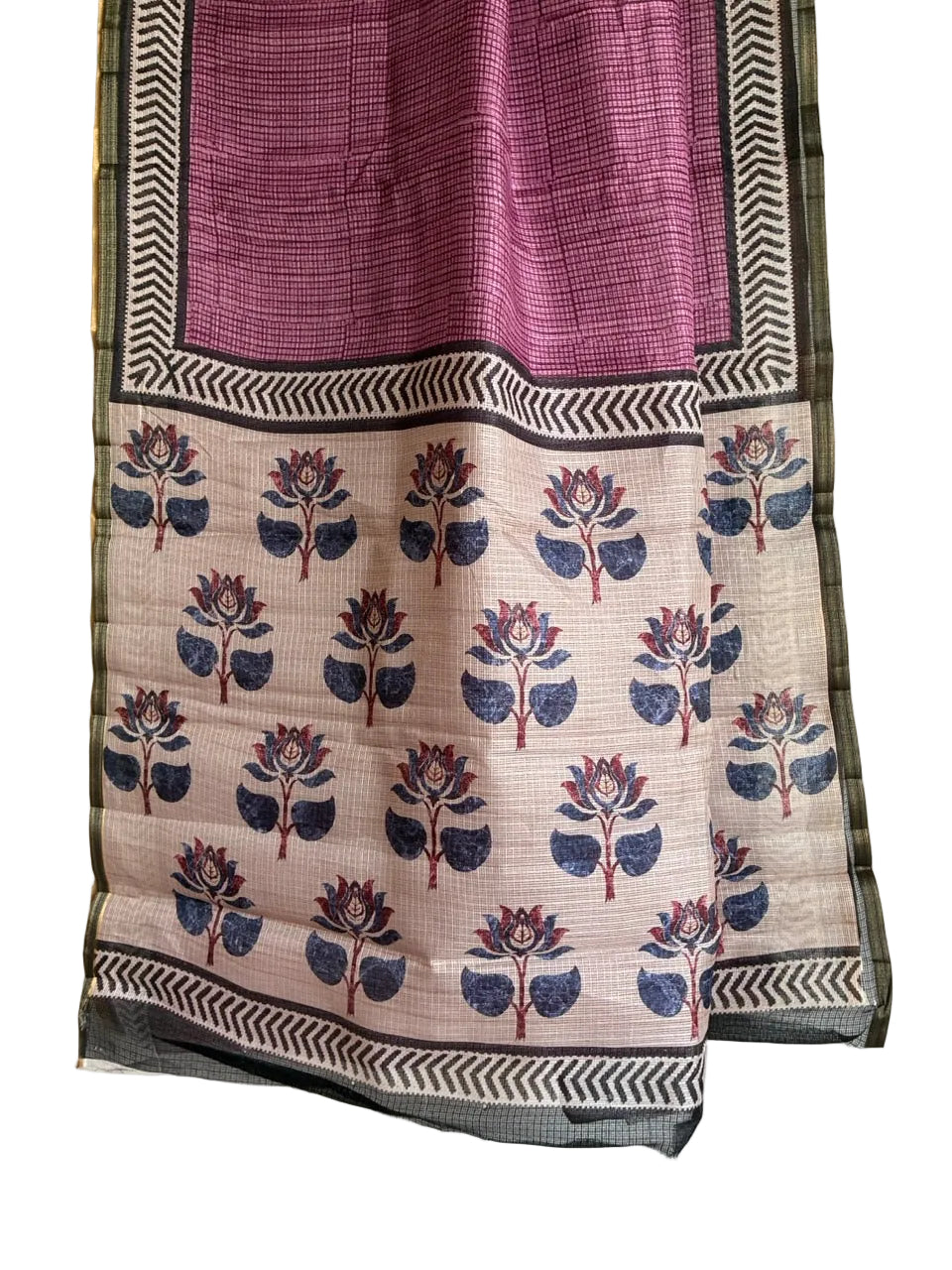 Detailed view of contrasting pale pallu featuring indigo blue and plum floral motifs
