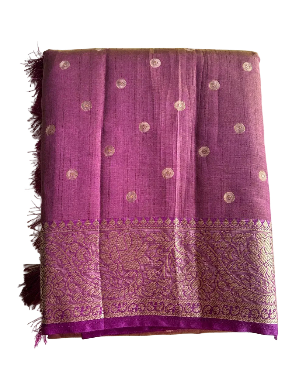 Neatly folded light comfortable purple saree showcasing gold butti weave and floral border detail