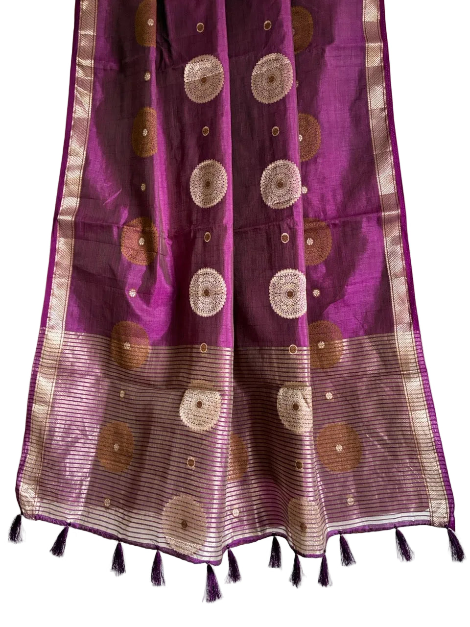 Detailed view of luminous striped purple saree pallu with gold detailing and pink tassels