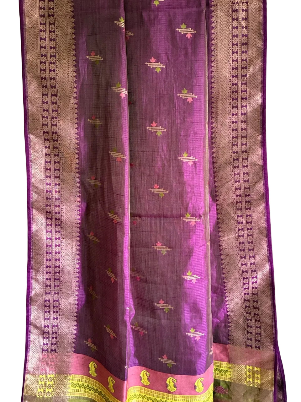 Close up of soft breathable purple saree weave featuring fine border detailing and rich contrast accents